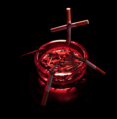 Image showing cigarette cross in ashtray