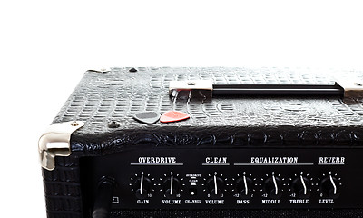 Image showing two plectrums on guitar amplifier