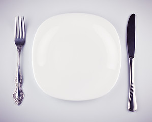 Image showing empty white dish knife and fork