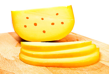 Image showing cheese slices on cutting board