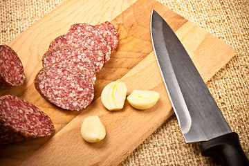 Image showing sausage, garlic and knife