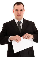 Image showing businessman ready tear paper