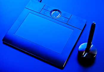 Image showing drawing tablet in blue light