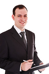 Image showing smiling businessman with pen and notepad