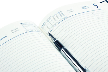 Image showing fountain pen on opened diary