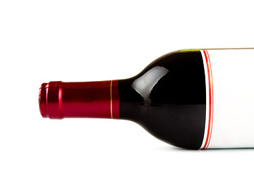 Image showing laying bottle of red wine closeup