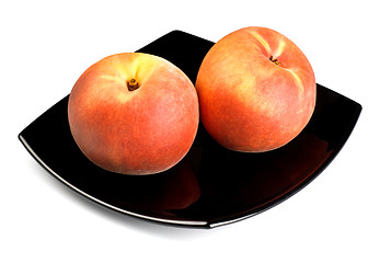 Image showing red peaches on black dish