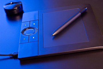 Image showing drawing tablet in blue light