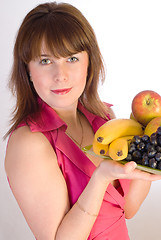 Image showing beautiful smiling girl with dish of fruits