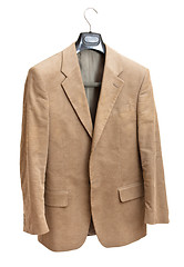 Image showing beige jacket on hanger