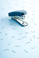 Image showing office stapler and many clips