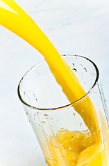 Image showing juice is poured into a glass