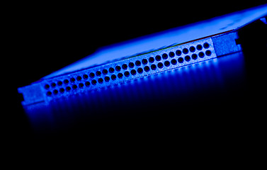 Image showing pin socket closeup in blue light