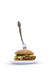 Image showing fork stuck in a fat sandwich