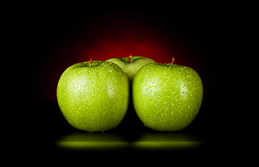 Image showing apples in red light