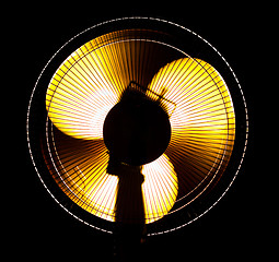 Image showing big office fan in yellow light