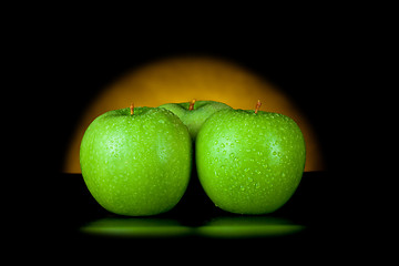 Image showing green apples in yellow light