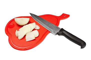 Image showing onion and knife on cutting board