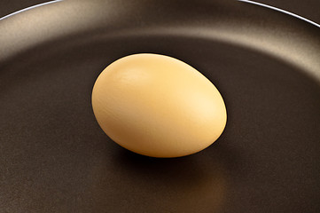 Image showing brown egg on frying pan