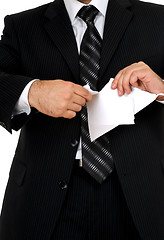 Image showing businessman tear paper