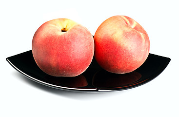 Image showing red peaches on black dish