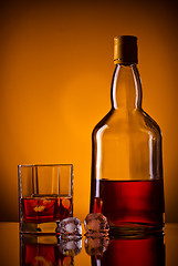 Image showing whiskey bottle, ice and glass
