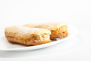 Image showing two eclairs on white dish