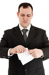 Image showing businessman tear paper