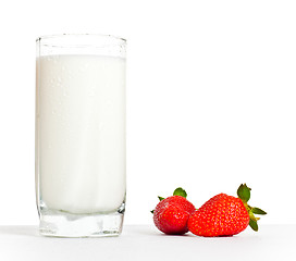 Image showing glass of milk and two strawberries