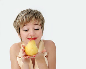 Image showing Funny girl with a pear