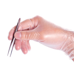 Image showing hand in rubber glove holding tweezers