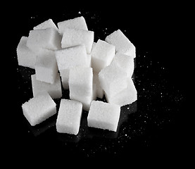 Image showing pieces of sugar on black