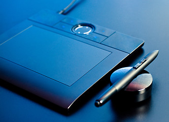 Image showing drawing tablet in blue light