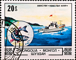 Image showing postage stamp shows boat and fish