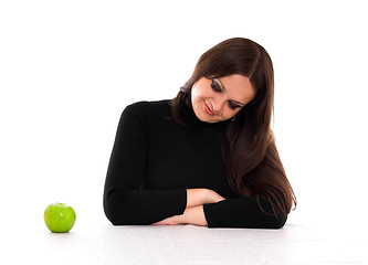 Image showing young woman staring at the apple