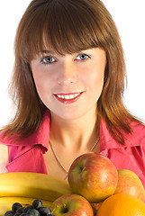 Image showing smiling girl with dish of fruits