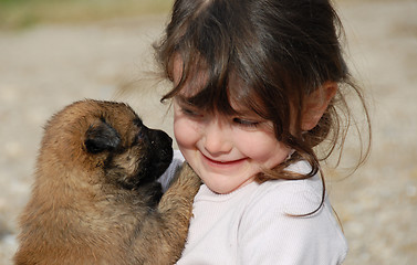 Image showing little girl and puppy