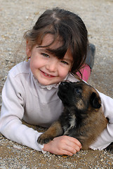 Image showing girl and puppy