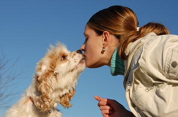 Image showing kissing woman and dog