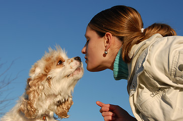 Image showing kissing woman and dog