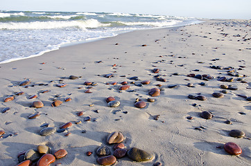 Image showing background of seashore little stones reflection 
