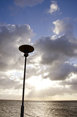 Image showing park lamp on background of cloudy sky and sunlight 