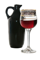 Image showing Black jug for wine and a glass of red wine 