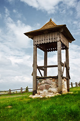 Image showing village well on green hill