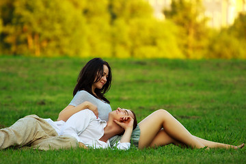 Image showing couple laying on park lawn