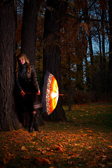 Image showing girl with umbrella in autumn park