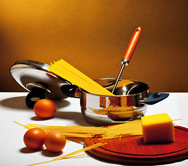 Image showing spaghetti, eggs and cheese on table