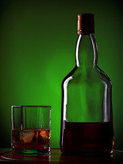 Image showing whiskey and glass on wooden tray