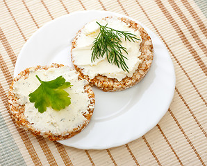 Image showing two corn bread on white dish