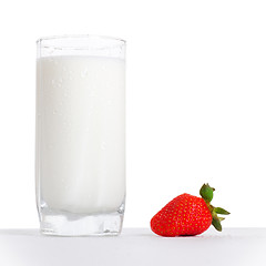 Image showing glass of milk and strawberry